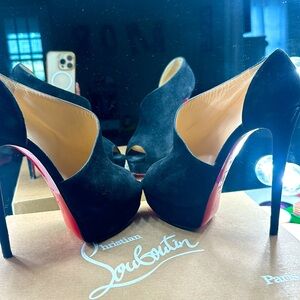 Christian loubiutin, size 37.5.  I wore them 2 times.